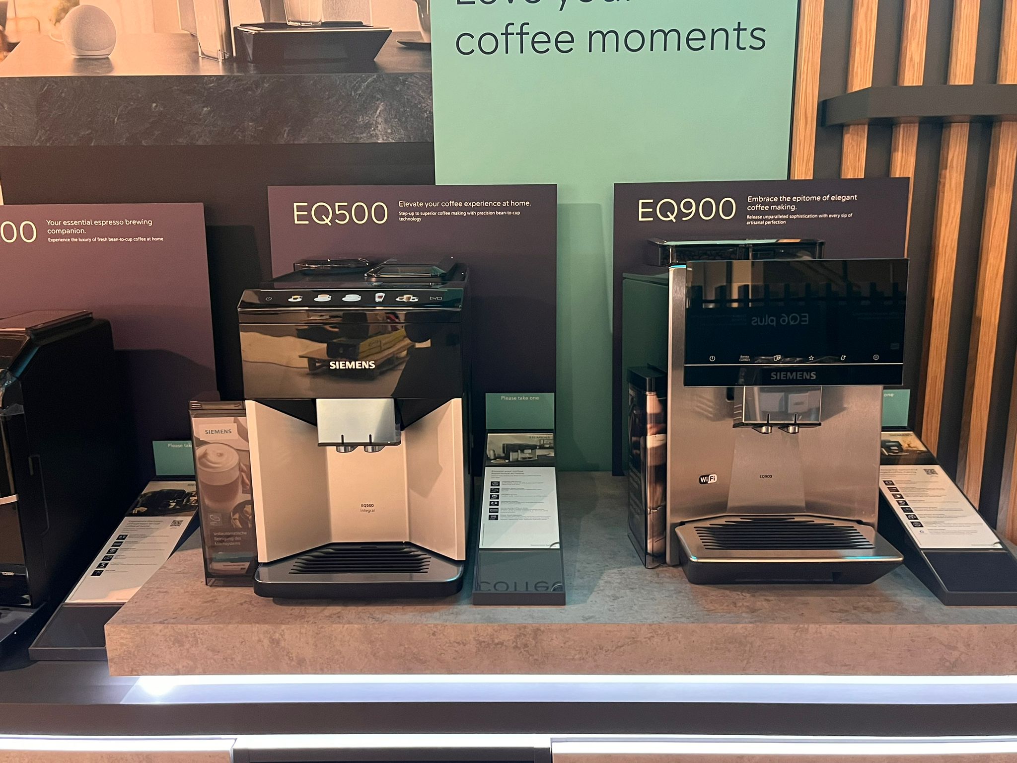 Siemens EQ display island at John Lewis Kingston with illuminated branded header panel and live demonstration products